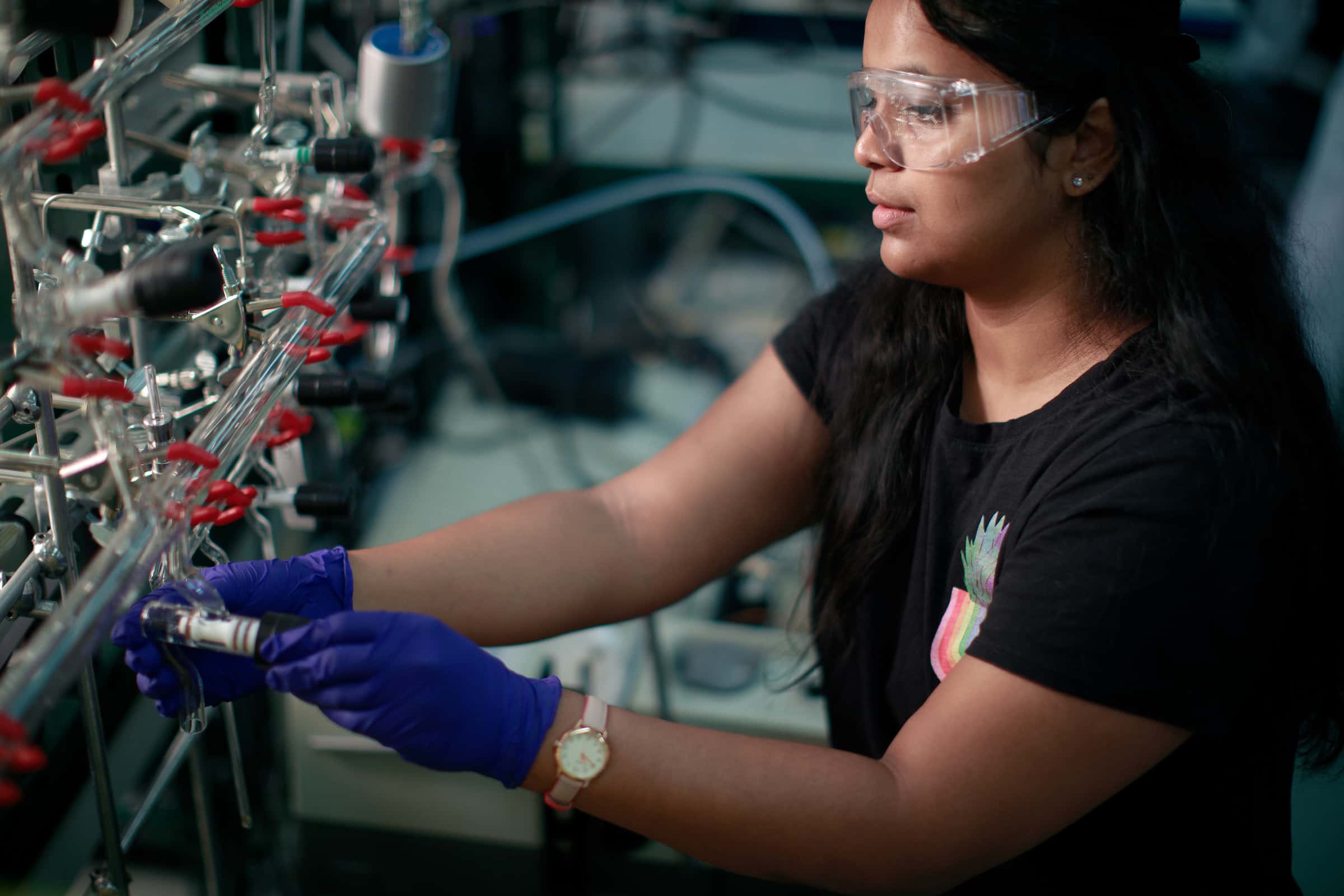 a students works on lab equipment
