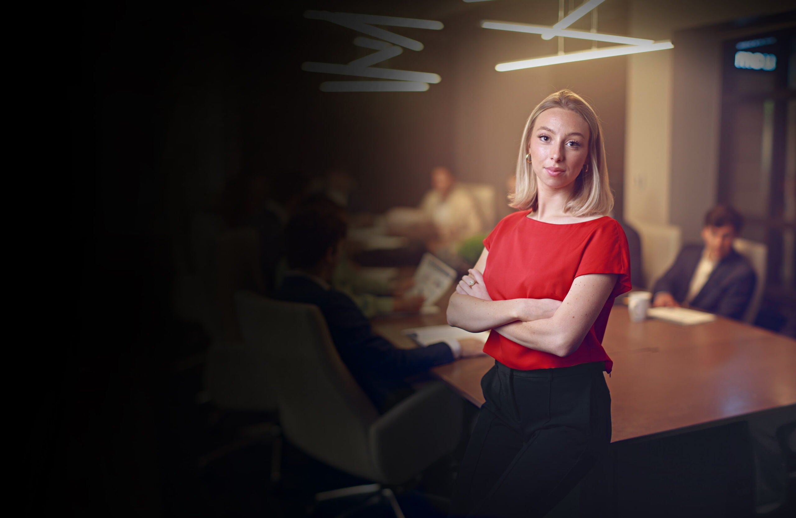 Female business student posing in a boardroom