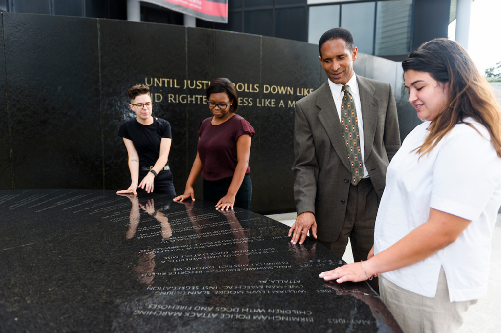 Students with tour guide at a museum