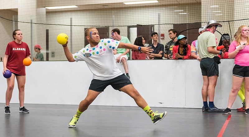 a group of students playing dodgeball at the UA recreation center