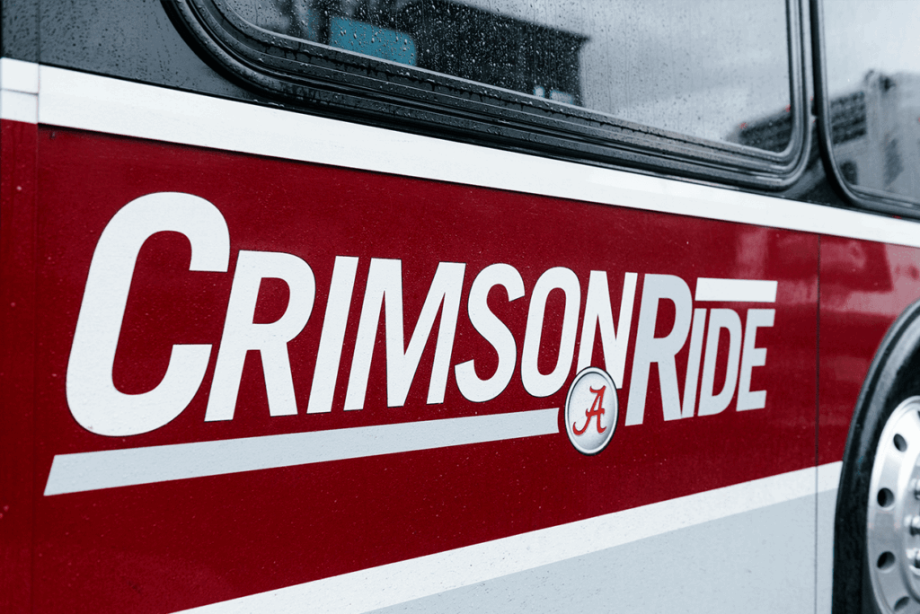 Side view of a Crimson RIde bus.