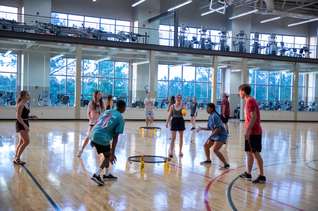 Students playing a game in a recreation center.