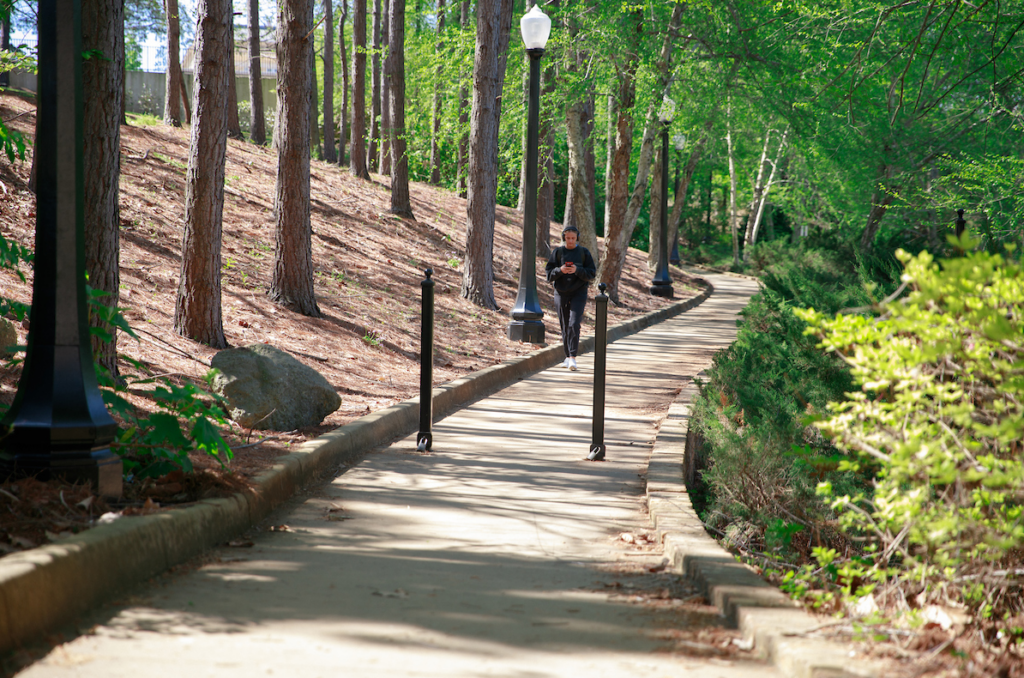 Student walking at the RIverwalk